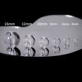 Clear glass sphere beads in descending sizes 16mm to 4mm on reflective surface