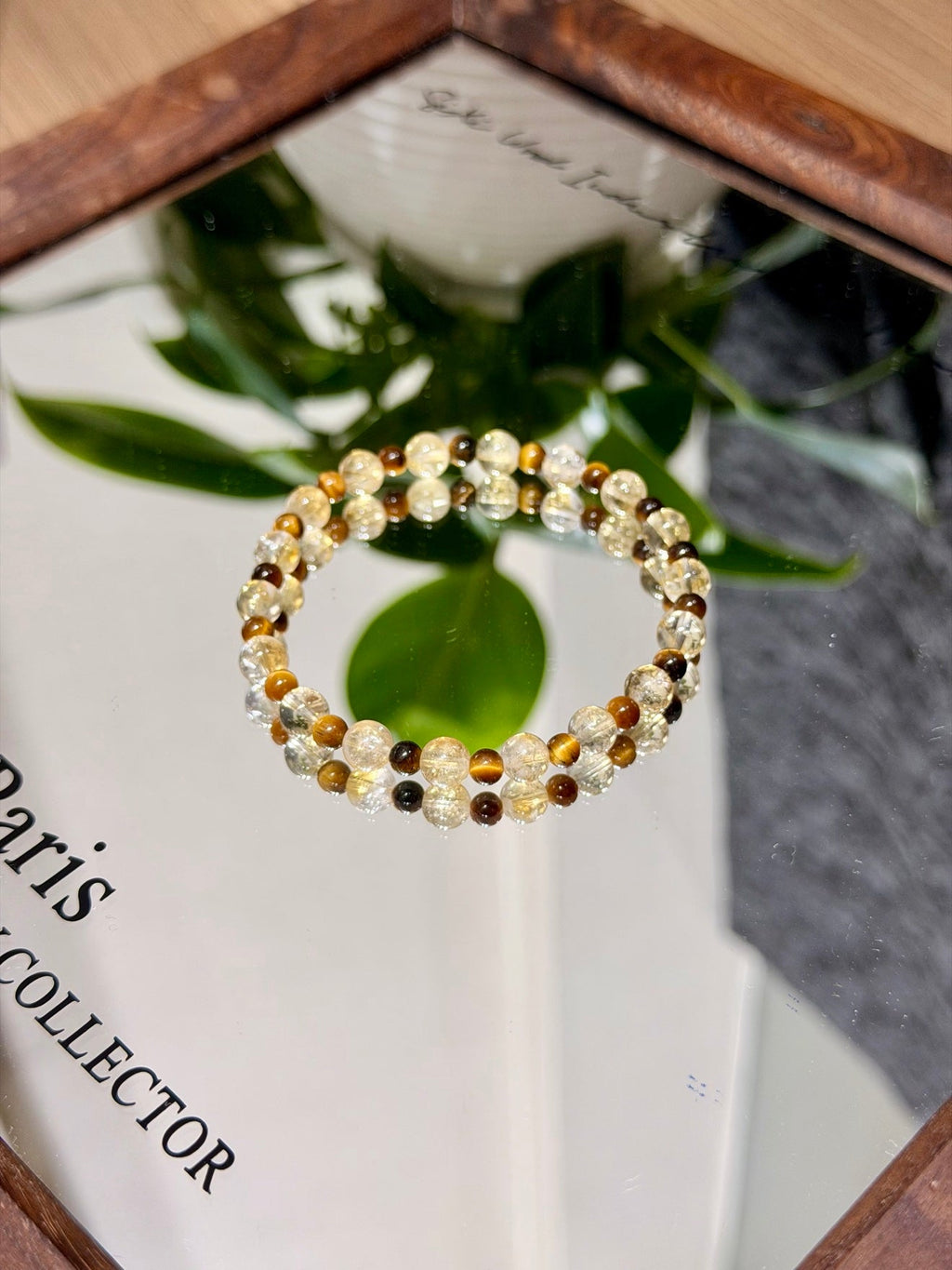 Beaded stretch bracelet with clear, yellow, and brown beads