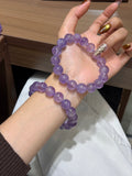 Premium lavender amethyst bracelet with 12.6mm beads worn on wrist