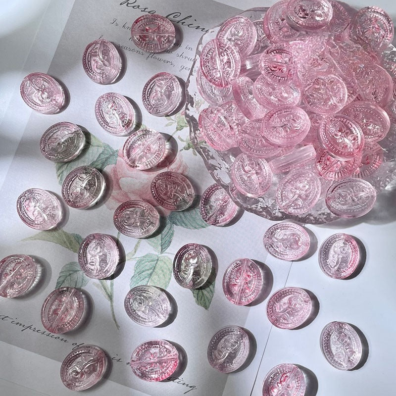 Pink translucent oval engraved glass beads with floral details