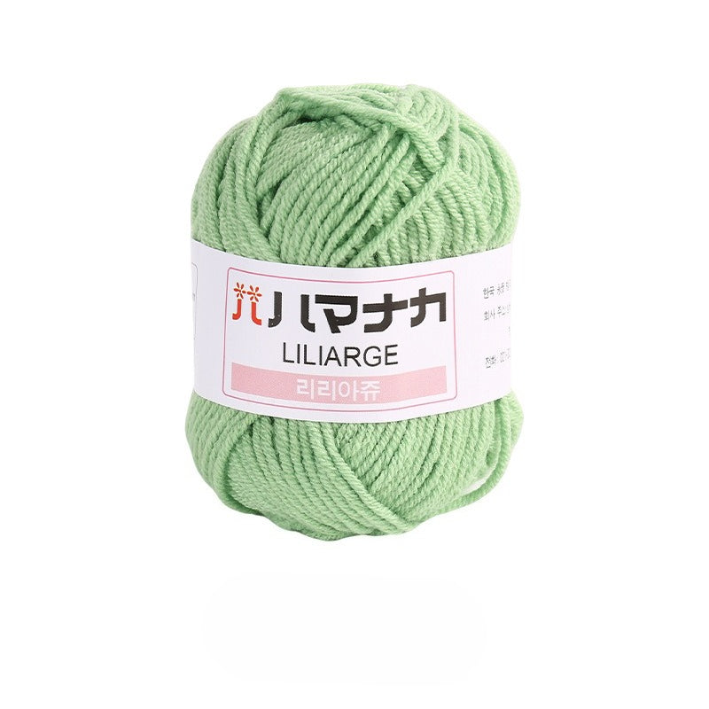 Bean green 4-ply milk cotton-acrylic yarn skein with white LILIARGE label on white background
